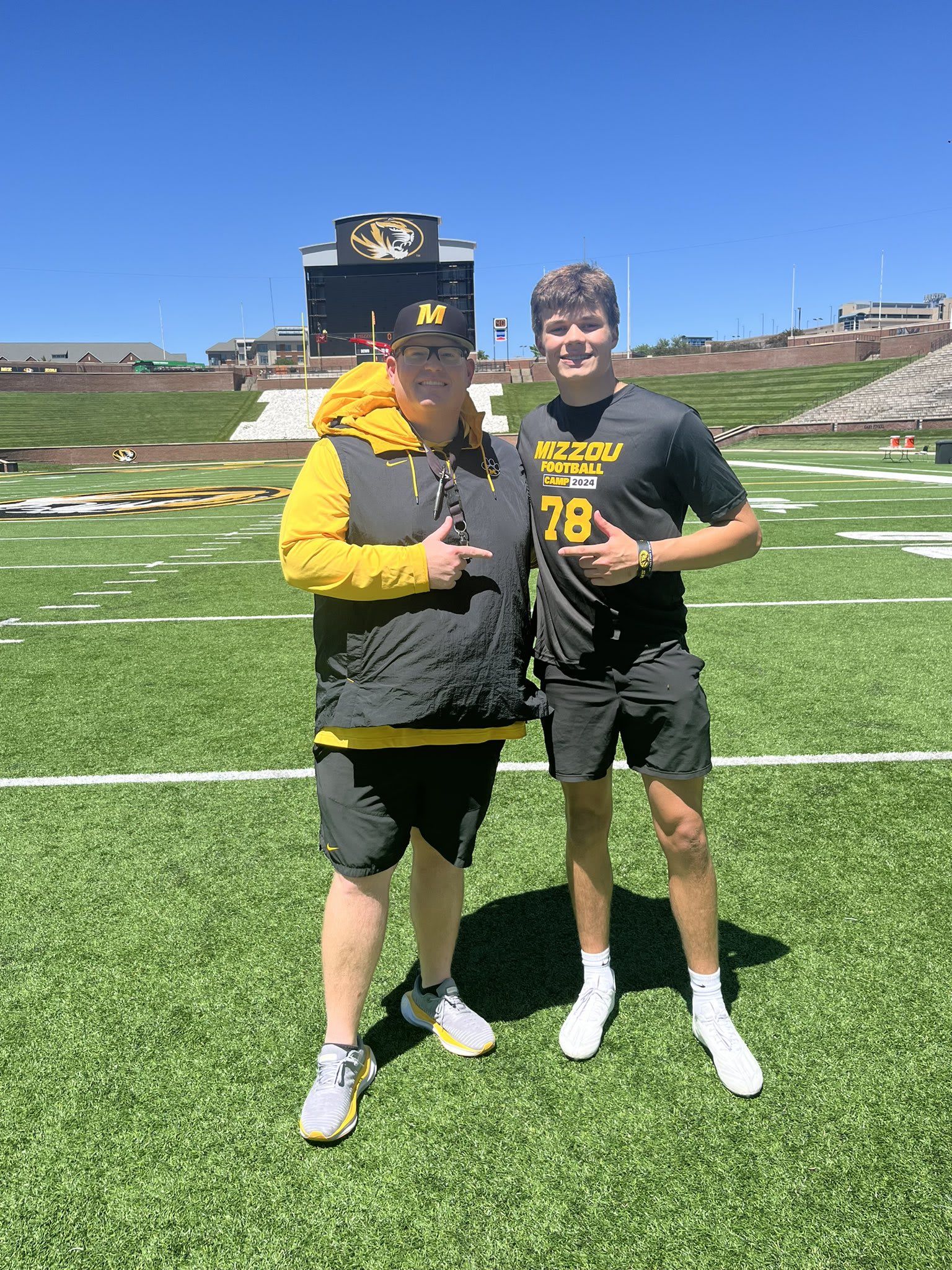 Erik Link (left) and Jack Brown (right) stand on Faurot Field at Memorial Stadium in Columbia, Missouri.