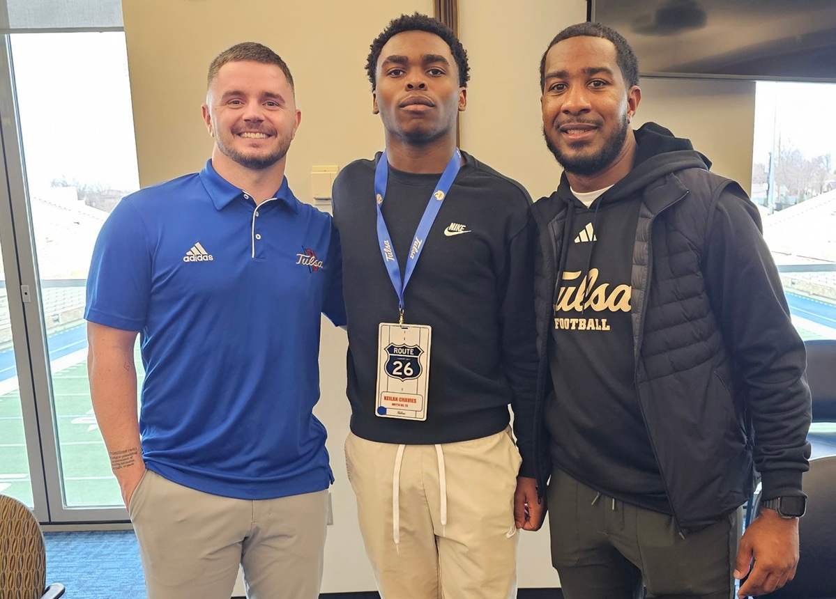 Keilan Chavies with Tulsa WR coach Ryan Switzer (left) and RB coach Kam Martin.